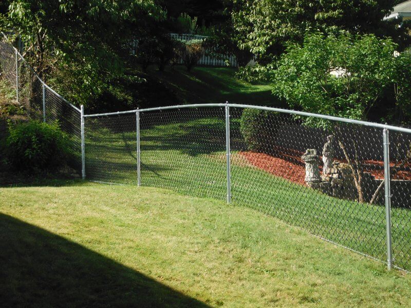 how to install a chain link fence on a slope
